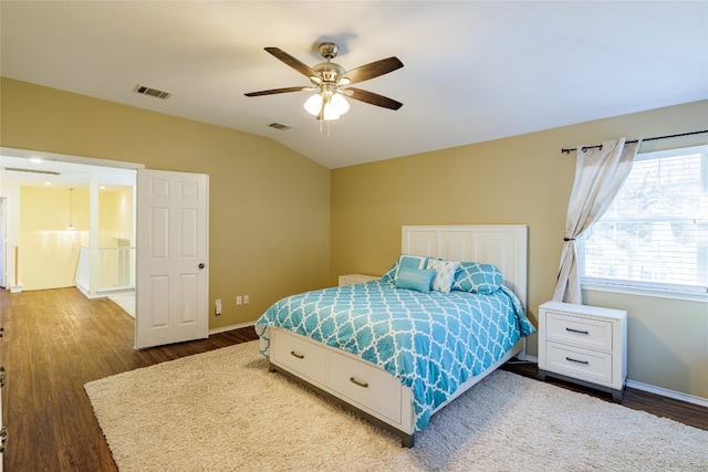 1301 Chardonnay Xing, Leander, TX 78641 - bedroom with wood finished floors, vaulted ceiling, baseboards, and ceiling fan