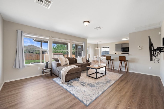 1528 Morning Mist Ln, Pflugerville, TX 78660 - living area featuring wood finished floors and baseboards