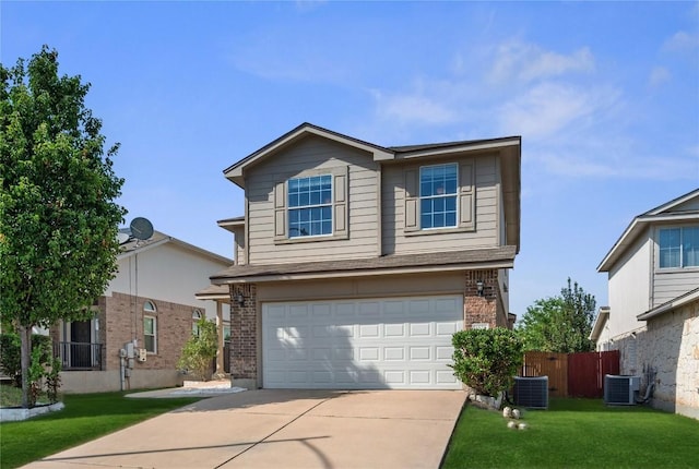 1528 Morning Mist Ln, Pflugerville, TX 78660 - traditional-style house featuring brick siding, a garage, central AC, and driveway