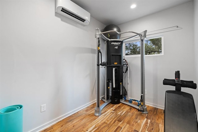 2001 Whitebead Trl, Austin, TX 78734 - exercise area with a wall mounted air conditioner, wood finished floors, baseboards, and recessed lighting