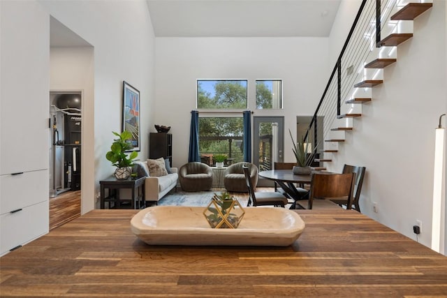 2001 Whitebead Trl, Austin, TX 78734 - living area featuring a high ceiling, stairs, and wood finished floors