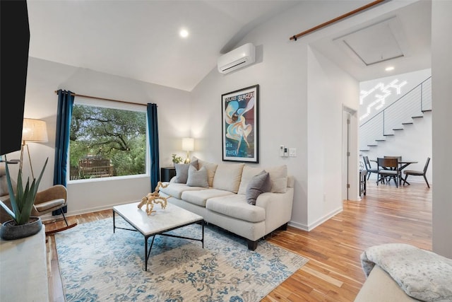 2001 Whitebead Trl, Austin, TX 78734 - living area with a wall mounted AC, vaulted ceiling, light wood finished floors, baseboards, and recessed lighting