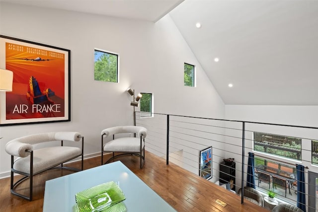 2001 Whitebead Trl, Austin, TX 78734 - living area featuring wood finished floors, an upstairs landing, high vaulted ceiling, baseboards, and recessed lighting