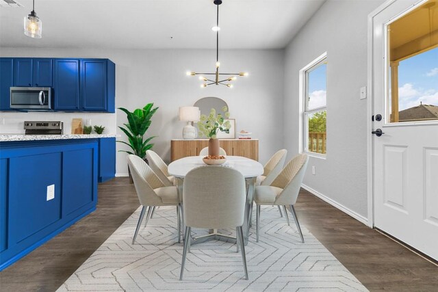 223 Hunters Brk, San Antonio, TX 78253 - dining area featuring a chandelier, dark wood-style floors, and baseboards