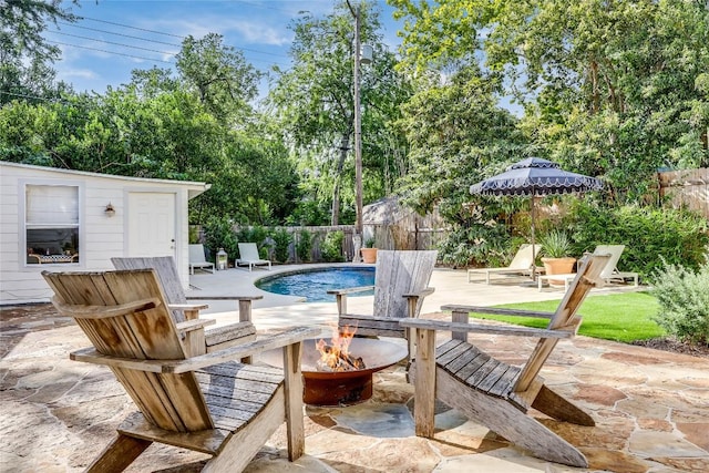 3202 Beverly Rd, Austin, TX 78703 - fenced backyard with a fire pit, a patio area, and view of scattered trees