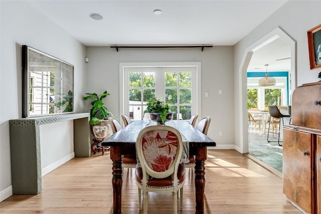 3202 Beverly Rd, Austin, TX 78703 - dining space with light wood-type flooring and arched walkways