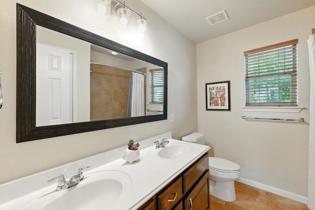 601 Harris Dr, Austin, TX 78737 - bathroom with toilet, double vanity, tile patterned floors, a shower with shower curtain, and baseboards