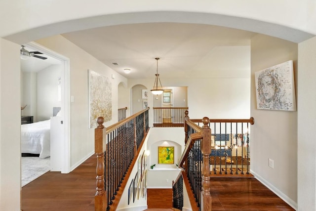 601 Harris Dr, Austin, TX 78737 - stairs with wood finished floors, baseboards, a ceiling fan, and arched walkways