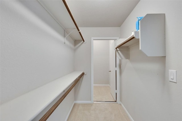 516 E Slaughter Ln Unit 2303, Austin, TX 78744 - walk in closet featuring light carpet