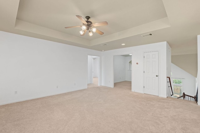 16304 Fincastle Dr, Austin, TX 78717 - unfurnished room with a tray ceiling, light carpet, and a ceiling fan