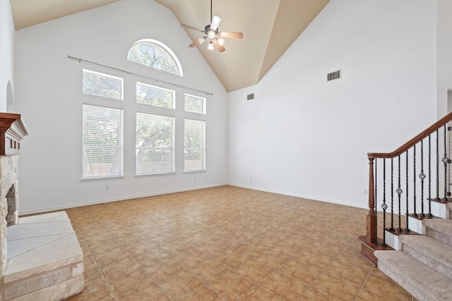 16304 Fincastle Dr, Austin, TX 78717 - unfurnished living room featuring high vaulted ceiling, ceiling fan, stairway, and a fireplace with raised hearth