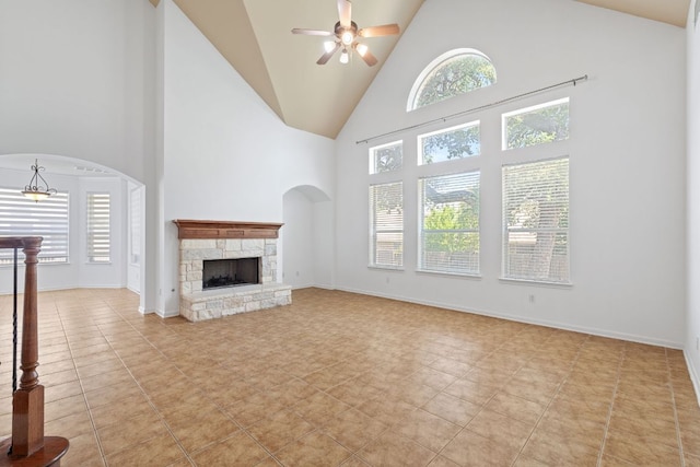 16304 Fincastle Dr, Austin, TX 78717 - unfurnished living room featuring high vaulted ceiling, a ceiling fan, a fireplace, light tile patterned floors, and baseboards