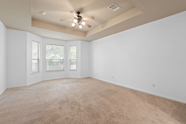 16304 Fincastle Dr, Austin, TX 78717 - empty room with a ceiling fan, a tray ceiling, light colored carpet, and baseboards