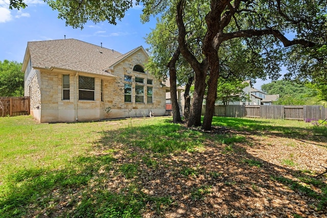 16304 Fincastle Dr, Austin, TX 78717 - rear view of house with stone siding and roof with shingles