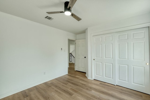 2106 Lobelia Dr, Cedar Park, TX 78613 - unfurnished bedroom with light wood-style floors, a closet, baseboards, and a ceiling fan