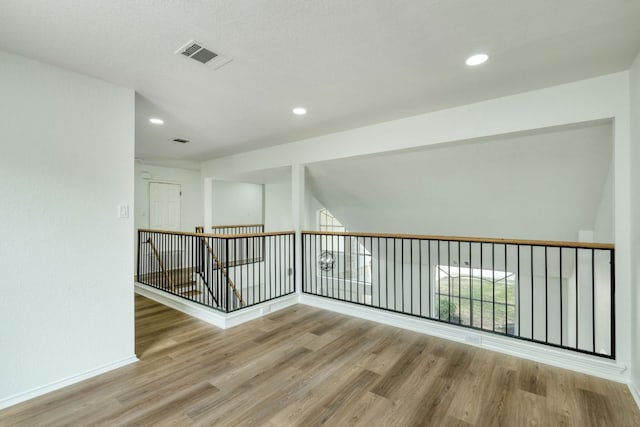 2106 Lobelia Dr, Cedar Park, TX 78613 - unfurnished room with wood finished floors, baseboards, and recessed lighting