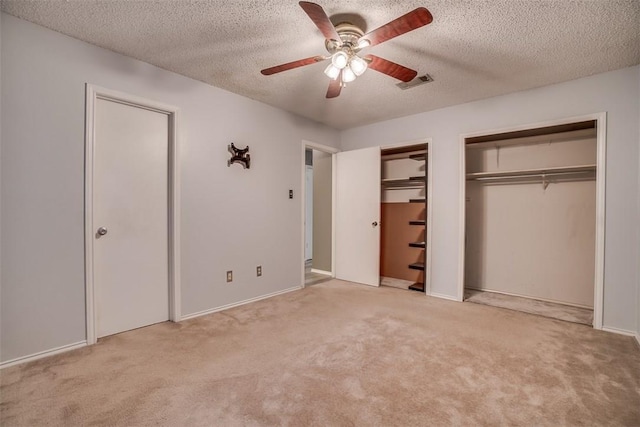 6009 Baton Rouge Dr, Austin, TX 78727 - unfurnished bedroom featuring multiple closets, carpet, a textured ceiling, a ceiling fan, and baseboards