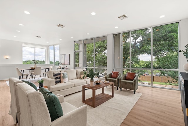 1500 Summit St Unit 4, Austin, TX 78741 - living area featuring a wall of windows, recessed lighting, light wood-style flooring, and plenty of natural light