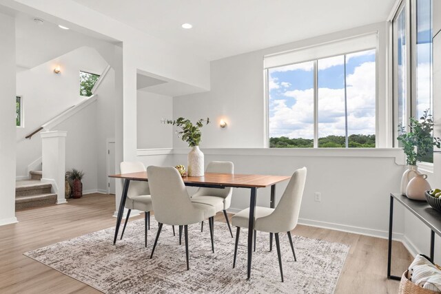 1500 Summit St Unit 4, Austin, TX 78741 - dining space with stairs, light wood finished floors, and recessed lighting