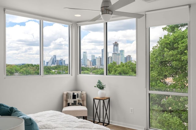 1500 Summit St Unit 4, Austin, TX 78741 - bedroom with multiple windows, a view of skyline, and wood finished floors