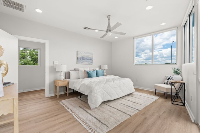 1500 Summit St Unit 4, Austin, TX 78741 - bedroom with light wood-type flooring, baseboards, recessed lighting, and a ceiling fan
