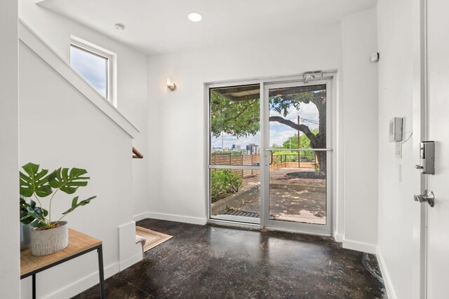 1500 Summit St Unit 4, Austin, TX 78741 - doorway to outside featuring plenty of natural light, baseboards, and recessed lighting