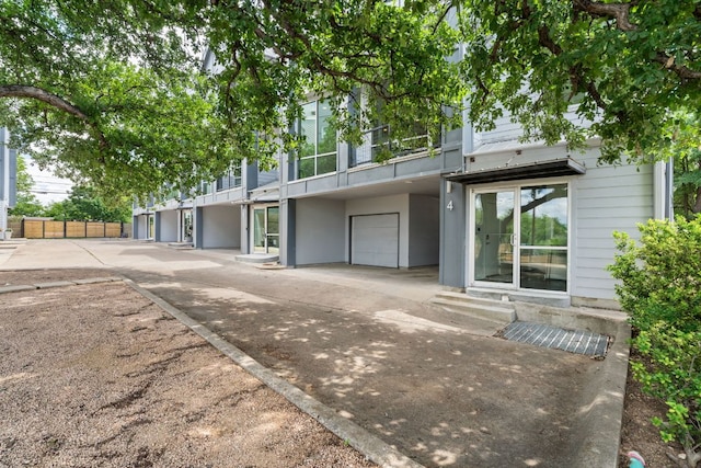 1500 Summit St Unit 4, Austin, TX 78741 - townhome / multi-family property featuring an attached garage and concrete driveway