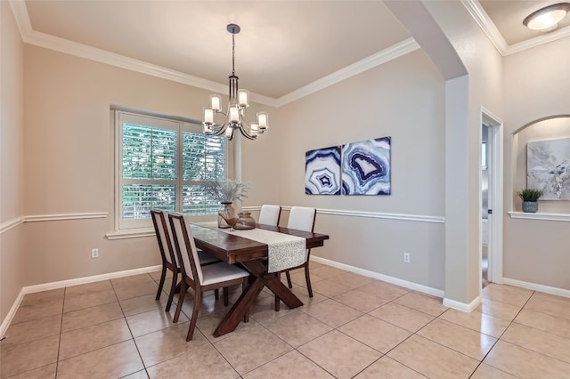 2503 Kinclaven Ct, Cedar Park, TX 78613 - dining room with light tile patterned floors, arched walkways, a chandelier, crown molding, and baseboards