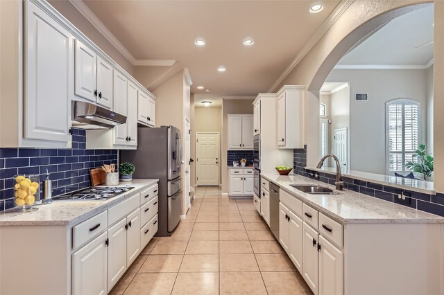 2503 Kinclaven Ct, Cedar Park, TX 78613 - kitchen featuring a sink, under cabinet range hood, appliances with stainless steel finishes, a peninsula, and white cabinetry