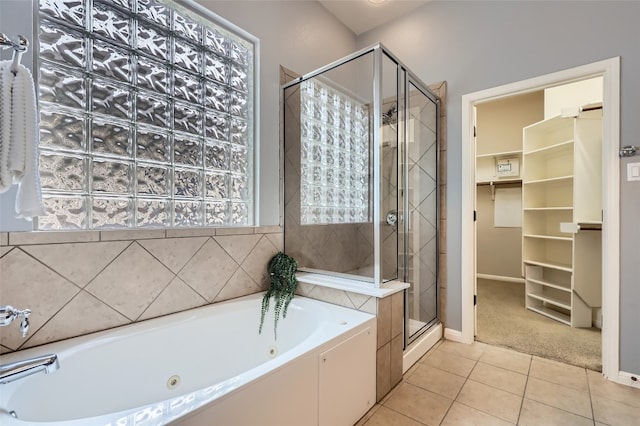 2503 Kinclaven Ct, Cedar Park, TX 78613 - full bath with a whirlpool tub, a stall shower, tile patterned flooring, baseboards, and a spacious closet