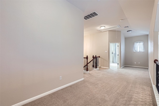 2503 Kinclaven Ct, Cedar Park, TX 78613 - spare room with attic access, vaulted ceiling, light colored carpet, and baseboards