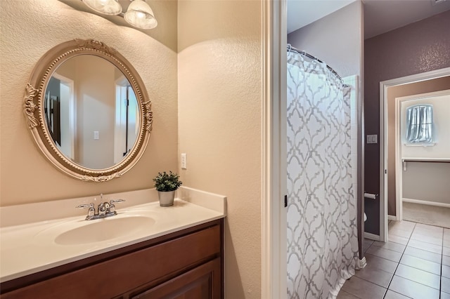 2503 Kinclaven Ct, Cedar Park, TX 78613 - full bath with tile patterned floors, vanity, a textured wall, and a shower with shower curtain