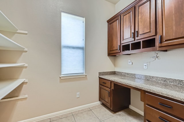 2503 Kinclaven Ct, Cedar Park, TX 78613 - unfurnished office featuring built in desk, light tile patterned floors, and baseboards