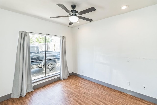 421 W San Antonio St Unit H1, San Marcos, TX 78666 - spare room featuring wood finished floors, baseboards, a ceiling fan, and recessed lighting