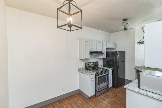 421 W San Antonio St Unit H1, San Marcos, TX 78666 - kitchen with electric range, under cabinet range hood, freestanding refrigerator, wood finished floors, and baseboards