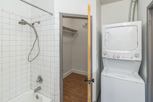 421 W San Antonio St Unit H1, San Marcos, TX 78666 - full bathroom featuring stacked washer / dryer, wood finished floors, and bathing tub / shower combination