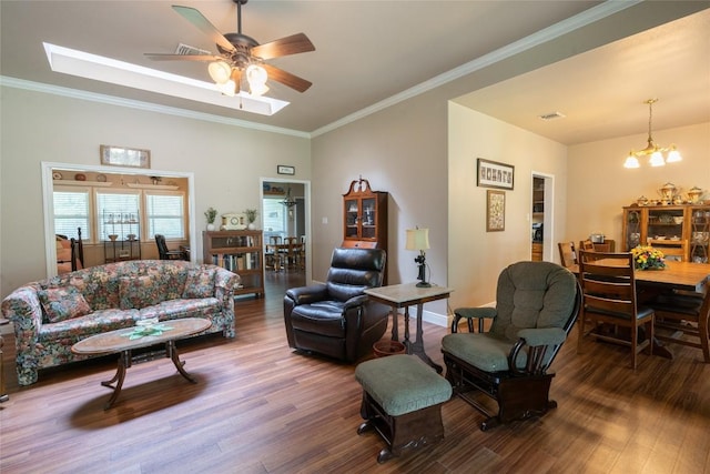 11525 Fm 86th Rd, Lockhart, TX 78644 - living area with wood finished floors, a chandelier, crown molding, and ceiling fan