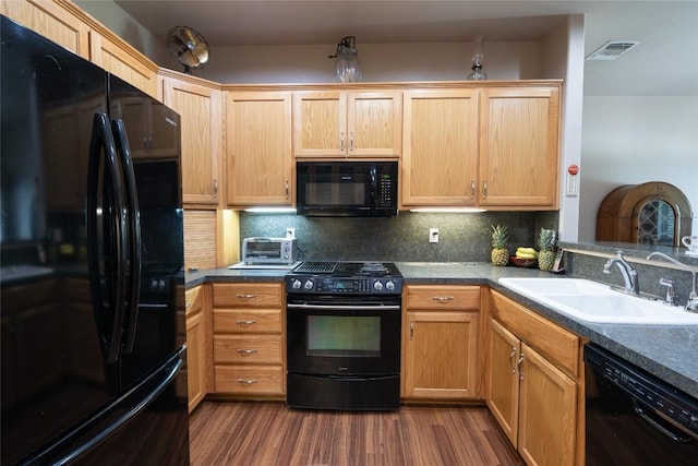 11525 Fm 86th Rd, Lockhart, TX 78644 - kitchen with black appliances, a sink, backsplash, and dark wood finished floors