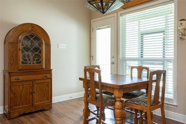 11525 Fm 86th Rd, Lockhart, TX 78644 - dining area with dark wood finished floors, baseboards, and plenty of natural light