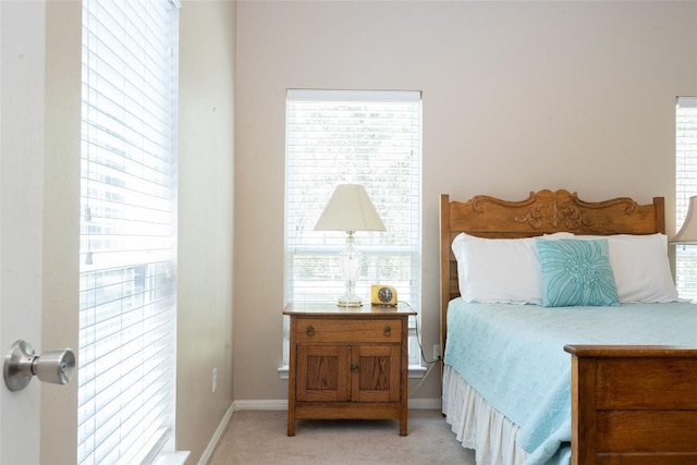11525 Fm 86th Rd, Lockhart, TX 78644 - bedroom featuring light carpet and baseboards