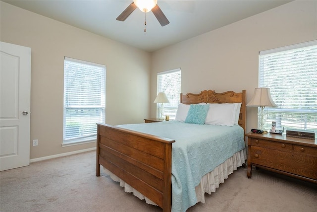 11525 Fm 86th Rd, Lockhart, TX 78644 - bedroom featuring light carpet, baseboards, and a ceiling fan