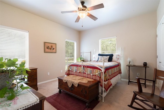 11525 Fm 86th Rd, Lockhart, TX 78644 - bedroom with light colored carpet, baseboards, and ceiling fan