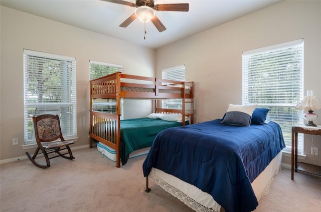 11525 Fm 86th Rd, Lockhart, TX 78644 - bedroom with light carpet, baseboards, and ceiling fan