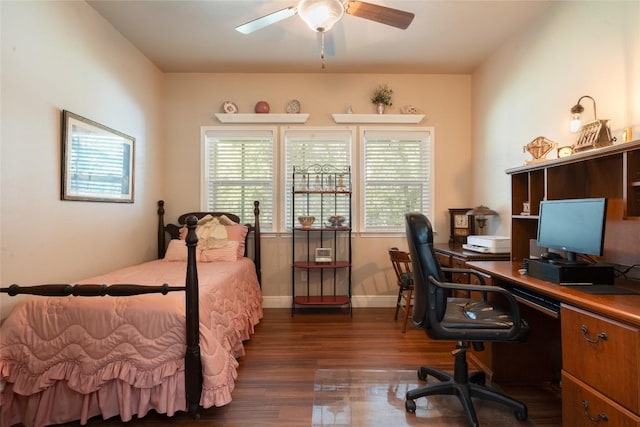 11525 Fm 86th Rd, Lockhart, TX 78644 - bedroom featuring dark wood-type flooring, a desk, and baseboards
