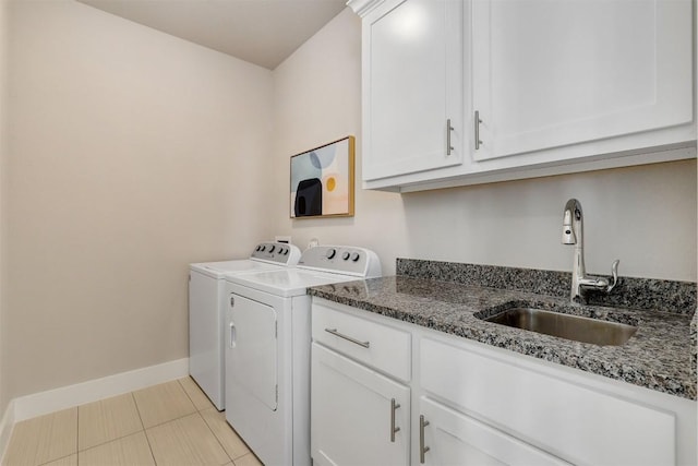 5502 Patagonia Pass, Austin, TX 78738 - laundry area with washing machine and dryer, baseboards, cabinet space, and light tile patterned floors