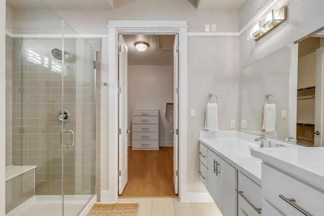 5502 Patagonia Pass, Austin, TX 78738 - full bathroom featuring a shower stall, vanity, and a spacious closet