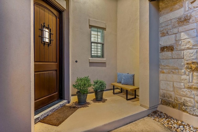 5502 Patagonia Pass, Austin, TX 78738 - view of exterior entry featuring stucco siding and stone siding