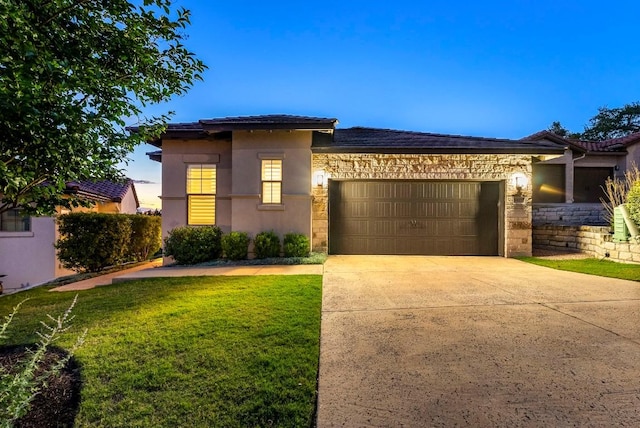 5502 Patagonia Pass, Austin, TX 78738 - view of front facade featuring stone siding, an attached garage, a front lawn, and driveway
