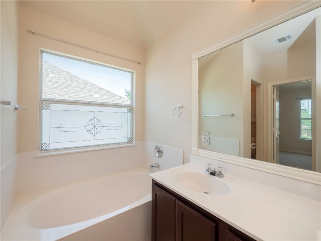 1010 Barclay Dr, Leander, TX 78641 - full bathroom featuring a garden tub, vanity, and toilet