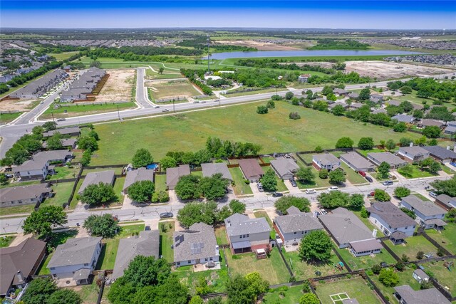 1010 Barclay Dr, Leander, TX 78641 - aerial view of property and surrounding area with a large body of water and nearby suburban area